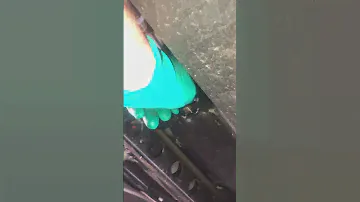 Mercedes Metris extra long oil drain plug. Draining the oil.
