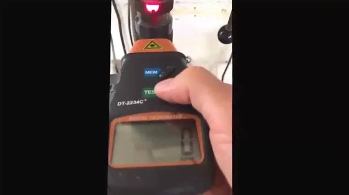 Using a photoelectric tachometer.